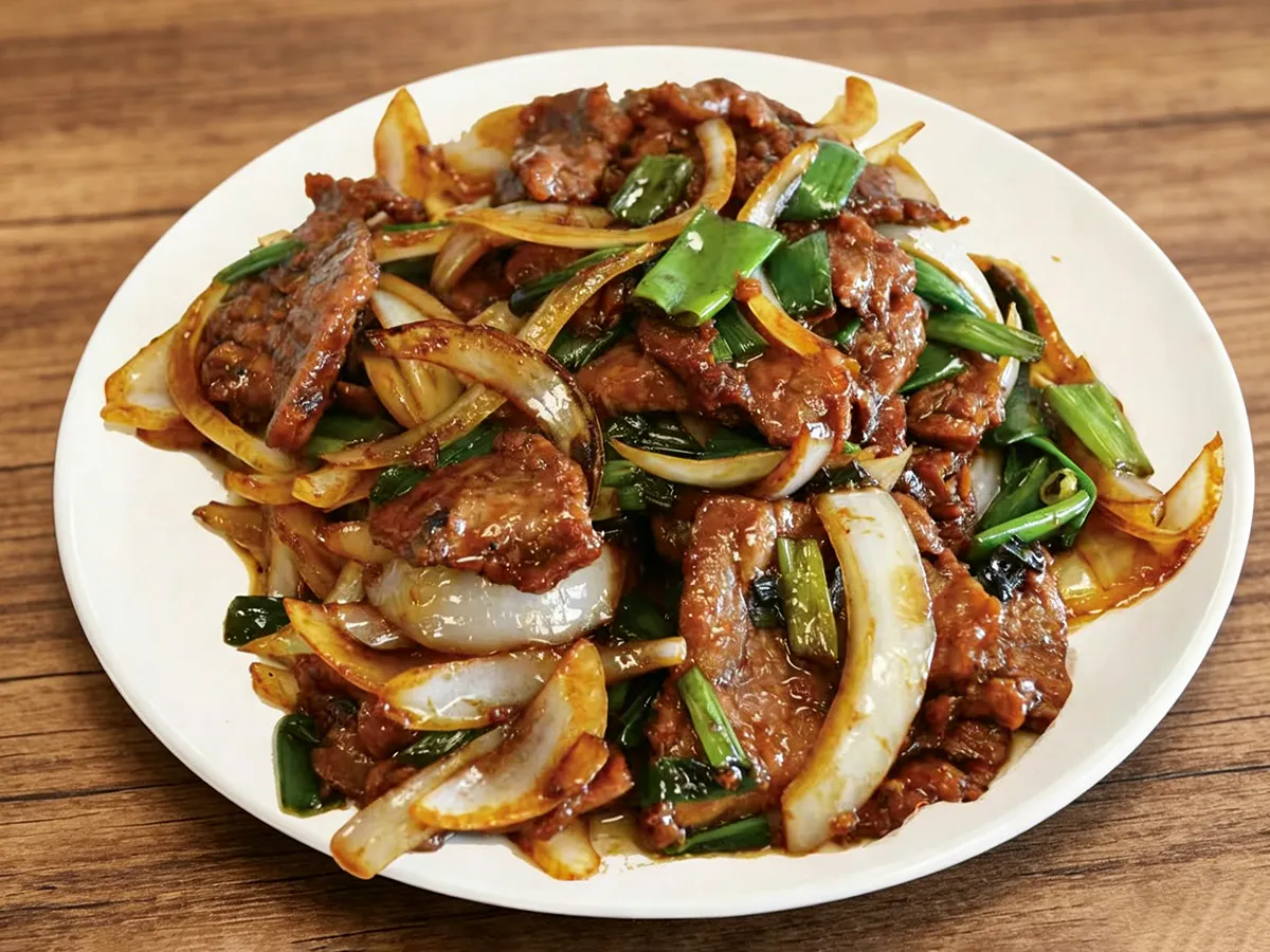 Stir-fried pork with onions scallions and rich savory sauce at Hau Po Chinese Kitchen, a Chinese Restaurant in Hauppauge